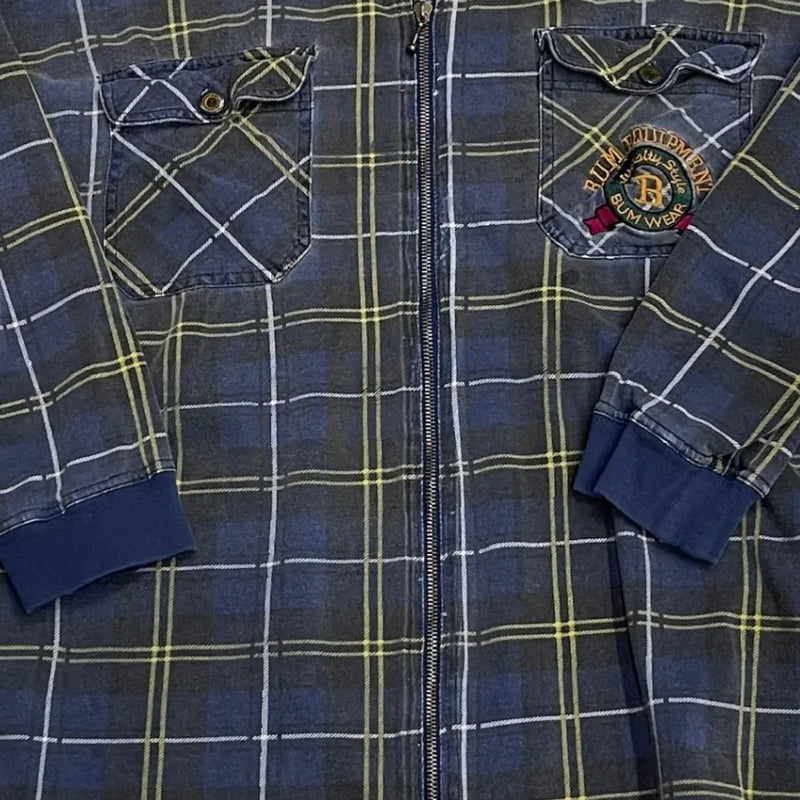 Vintage J.U.M.P. Garments Blue Plaid Flannel Shirt With Yellow And White Checkered Pattern, Zipper Front, Embroidered Chest Pocket Detailing, Buttoned Cuffs. Shirt Blue Size Center