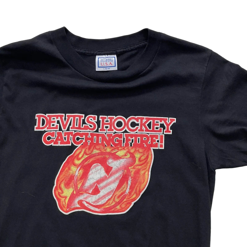 Vintage My Shirt Is Made In The U.S.A Graphic Print With 'DEVILS HOCKEY CATCHING FIRE!' And Flame Motif, Made In USA. T-Shirt Black Size Large