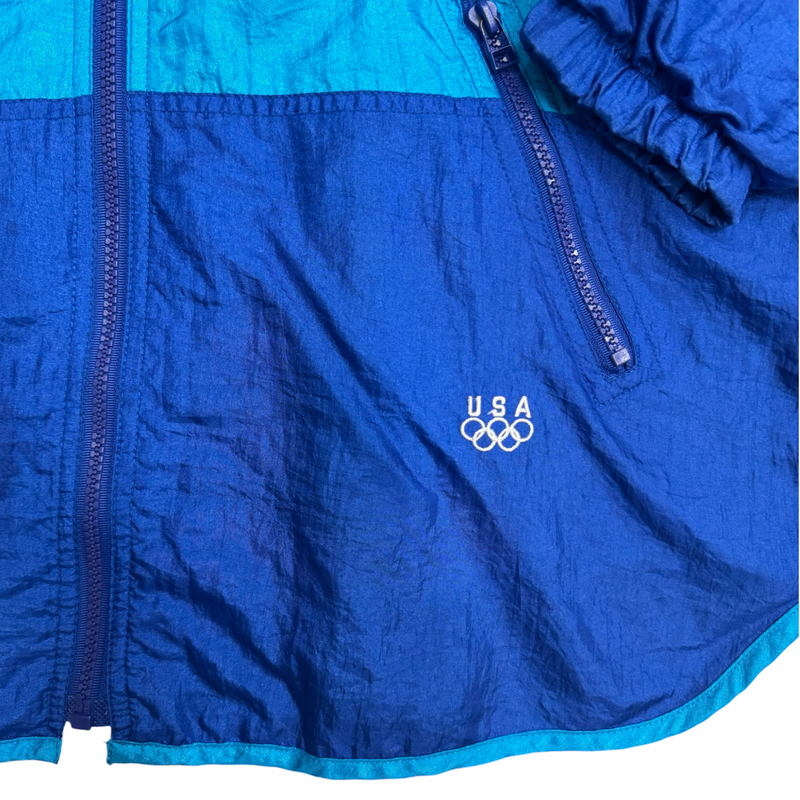 Vintage USA Blue With White And Lighter Blue Zip Up Light Jacket, USA Olympic Logo, Zip Front, Elastic Cuffs. Jacket Blue Size Medium